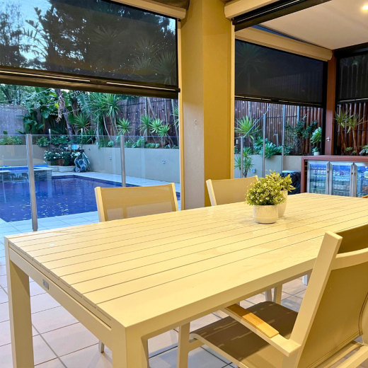 Outdoor blinds to separate outdoor dining area from swimming pool